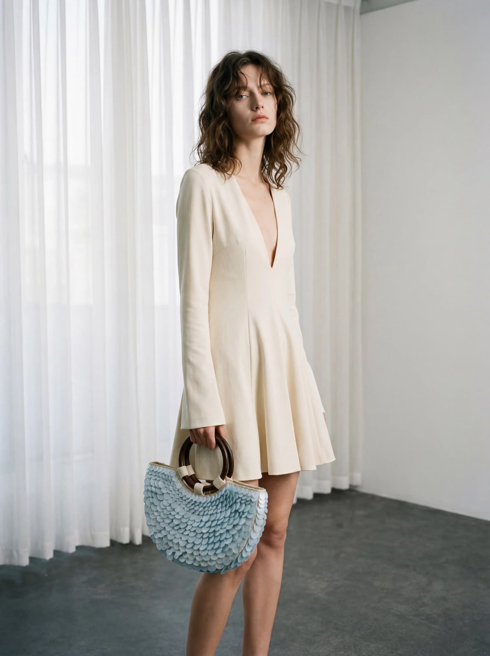 AI-generated e-commerce product photograph of a model holding a pale blue sequined handbag, created in Flowith, as taken from Flowith's template gallery