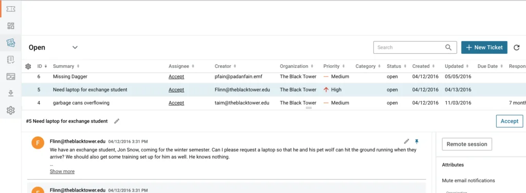 Spiceworks Cloud Help Desk open ticket queue with summary, assignee, organization and priority columns above a ticket thread