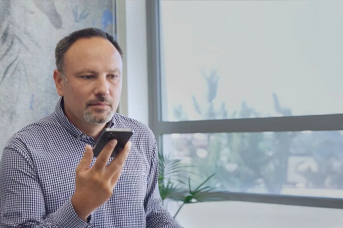 A customer speaking to PolyAI's voice agent on a phone, as taken from PolyAI