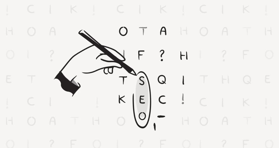 A hand circling SEO vertically in a word-search grid